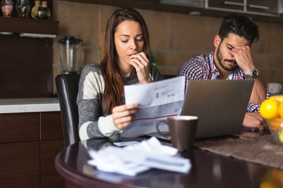 concerned couple on laptop