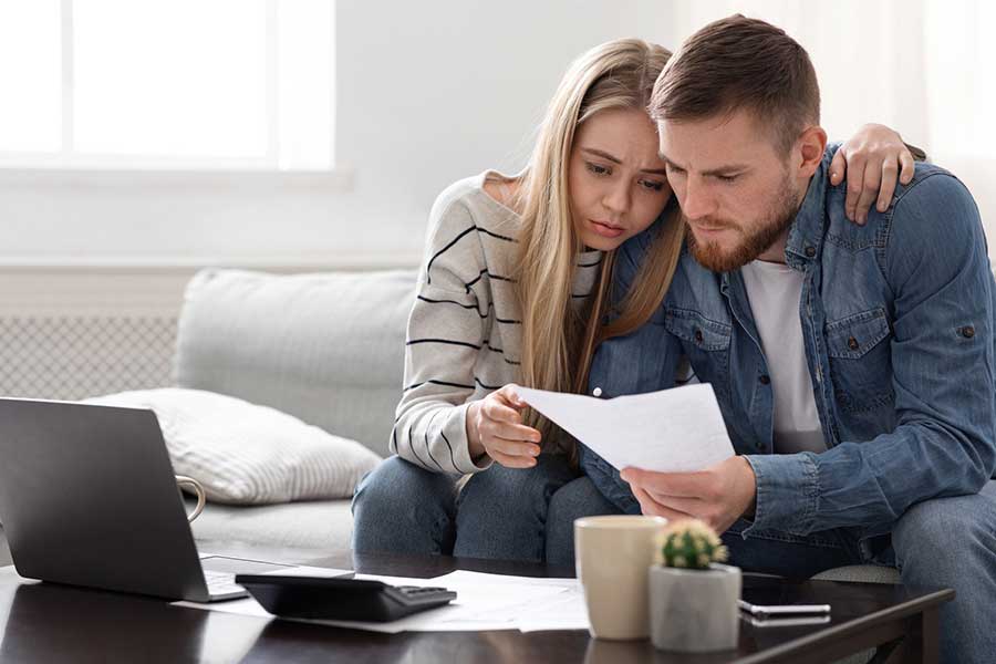 couple reading bank statement