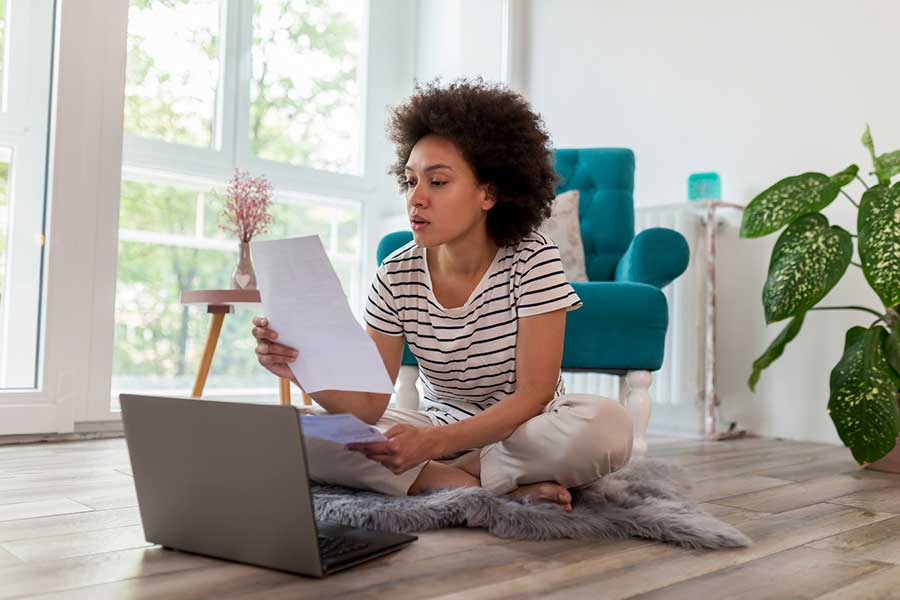 woman looking at bills