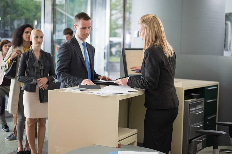 man at bank counter